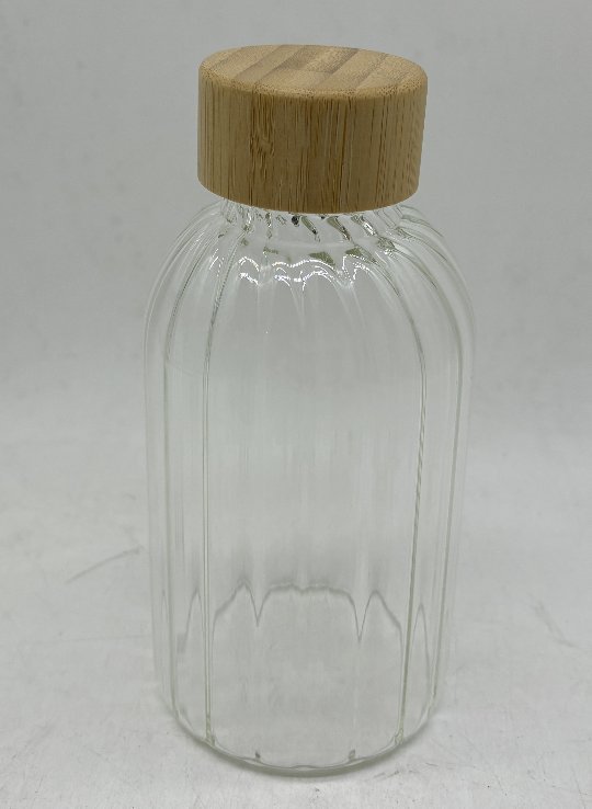 Glass bottle with bamboo lid